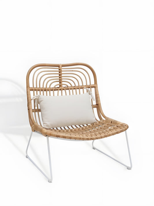 Aimar Rattan Lounge Chair with white metal legs front view by Mellowdays Furniture