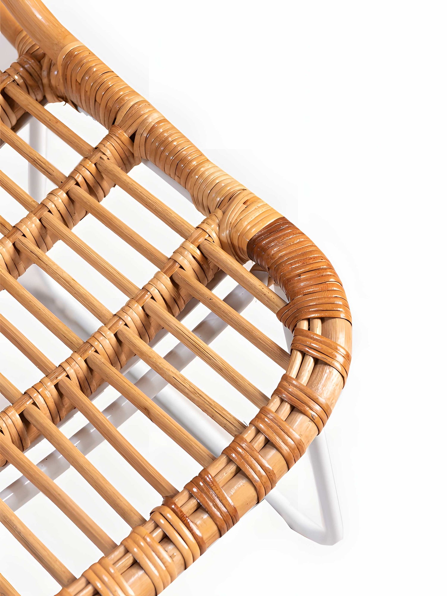 Close up of Aitor Rattan Dining Chairs with white metal legs showing seat texture - Mellowdays Furniture