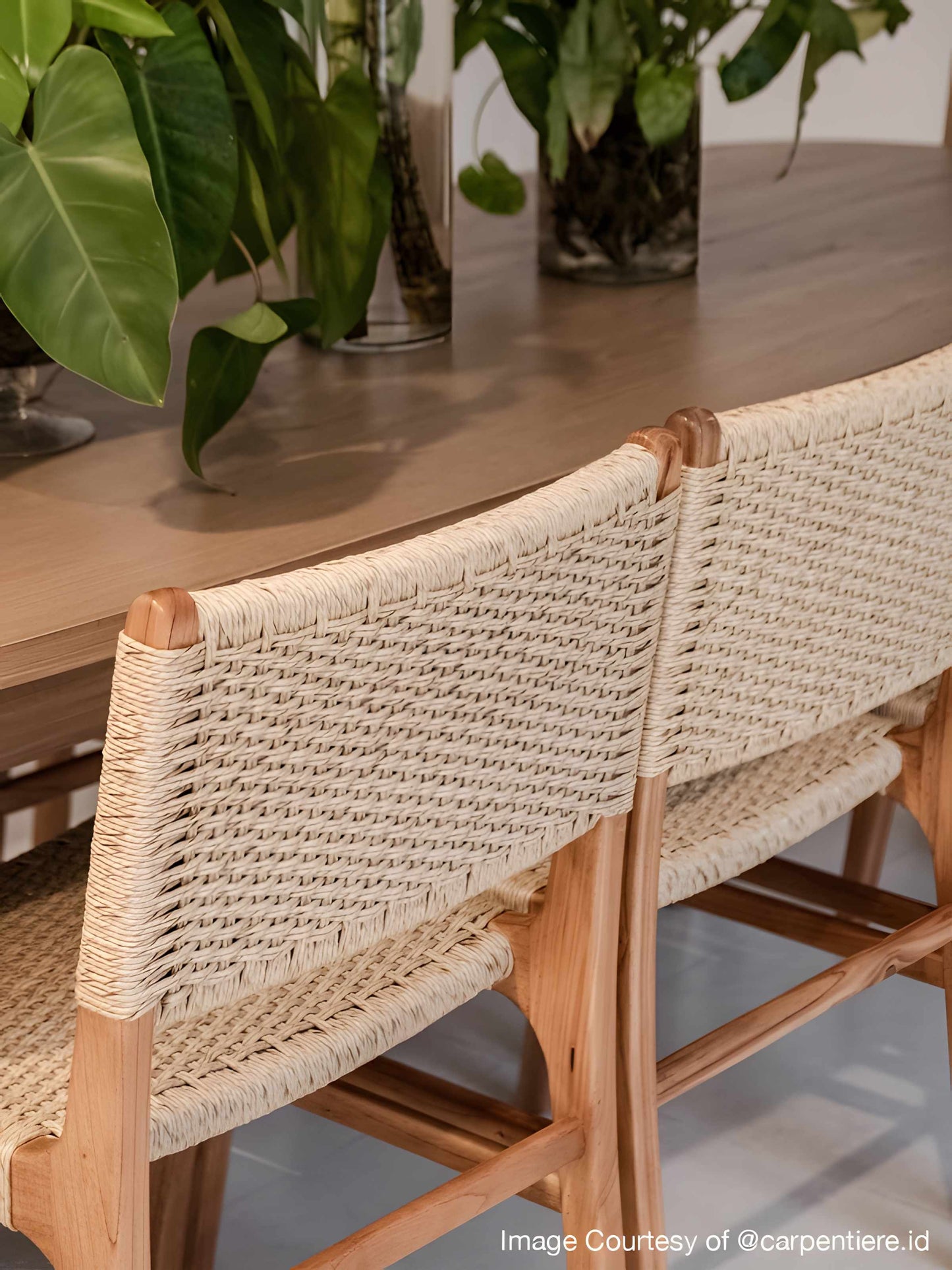 Dining room featuring Asturia wooden dining chairs with woven seats in natural peanut mind wood | Mellowdays Furniture