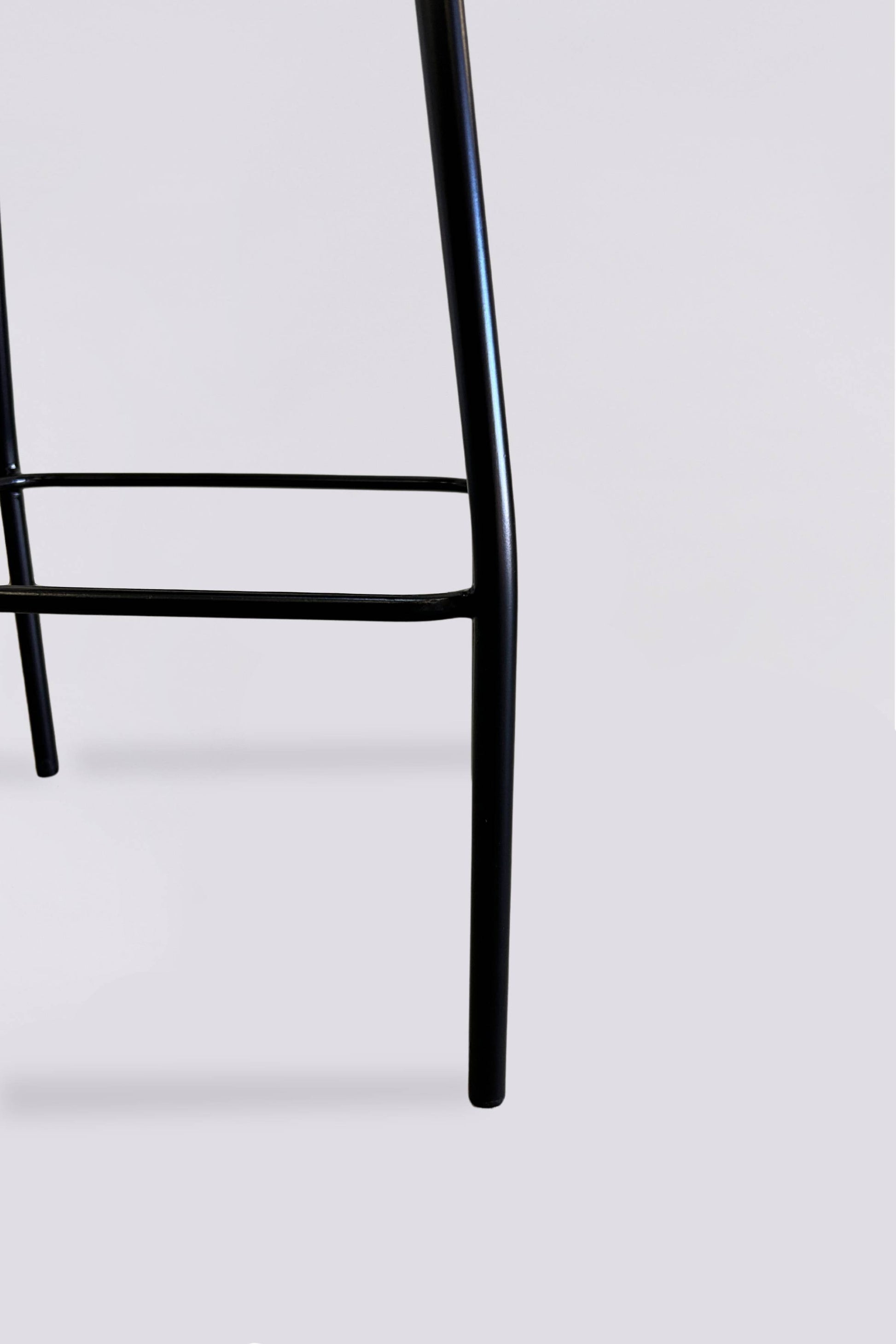 Bakanda set of 2 black colour teakwood and rattan 65cm counter stools legs close up by Mellowdays Furniture