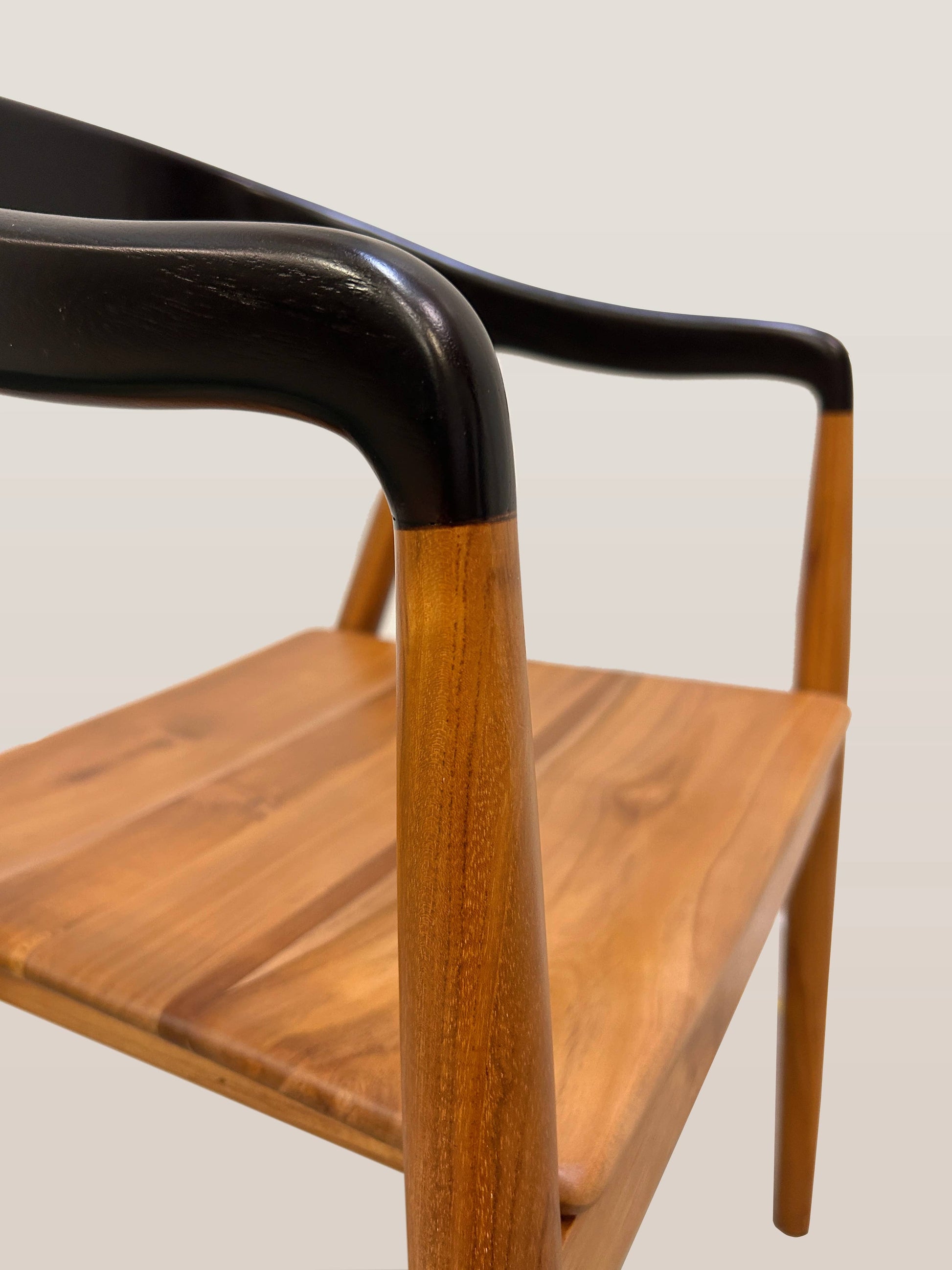 Smooth teak wood armrest detail on Jacobo dining chair | Mellowdays Furniture