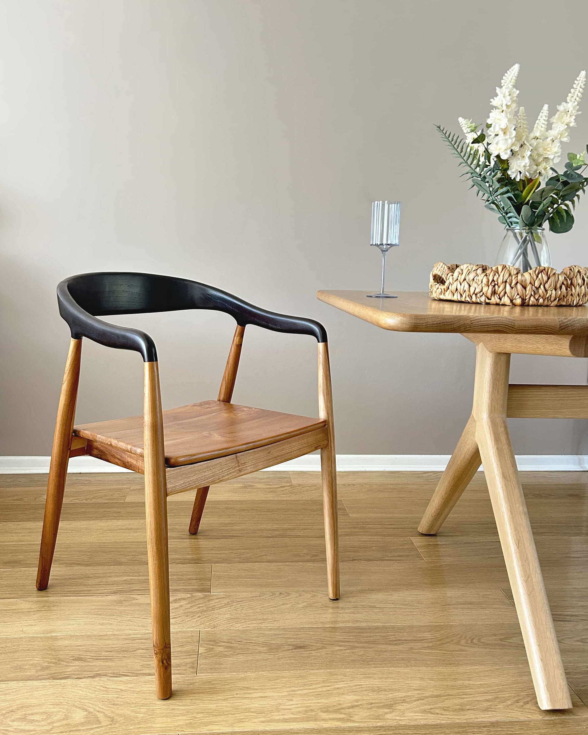 Jacobo teak wood dining chair with curved back and armrests in dark choco finish in dining room| Mellowdays Furniture
