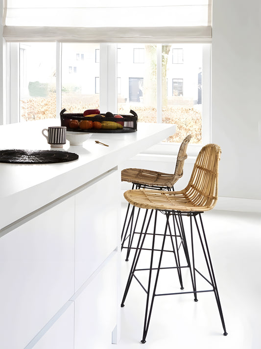 2 Julio Rattan Kitchen Stools with black metal legs in front of kitchen counter by Mellowdays Furniture