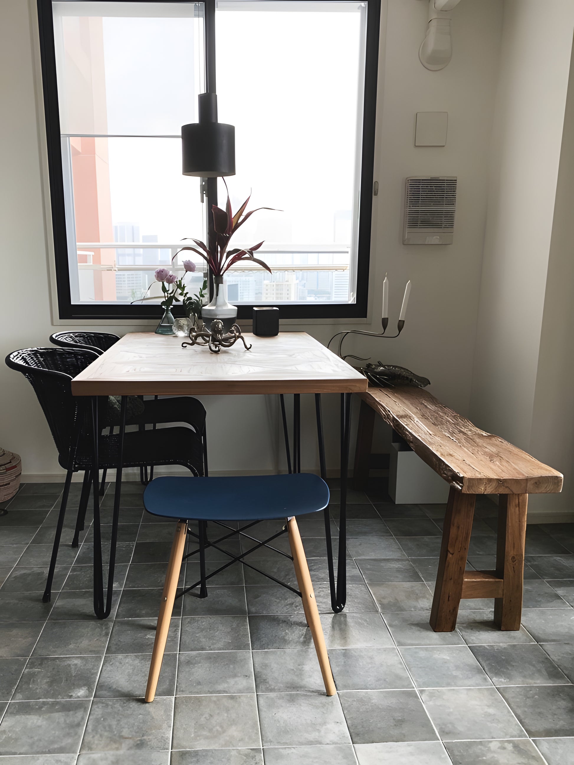 Segovia Reclaimed Teakwood Small Dining Table and Capri Reclaimed Teakwood Dining Bench with black hairpin legs and Capri reclaimed teak wooden bench in small dining room setting by Mellowdays Furniture