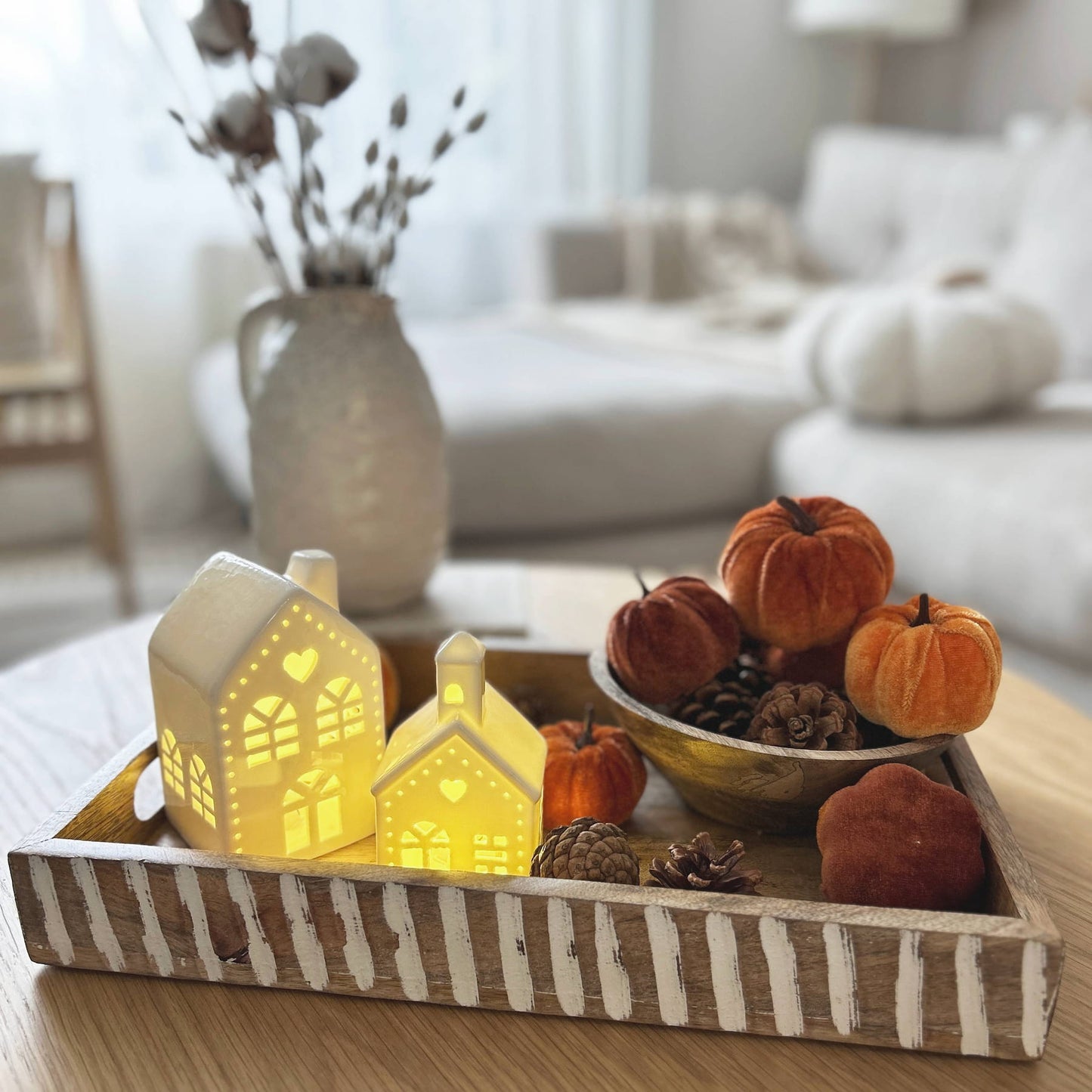 Autumn home decor styling featuring velvet pumpkins and pine cones, LED light up church, LED light-up house, and white wash mango wood tray | Mellowdays Furniture