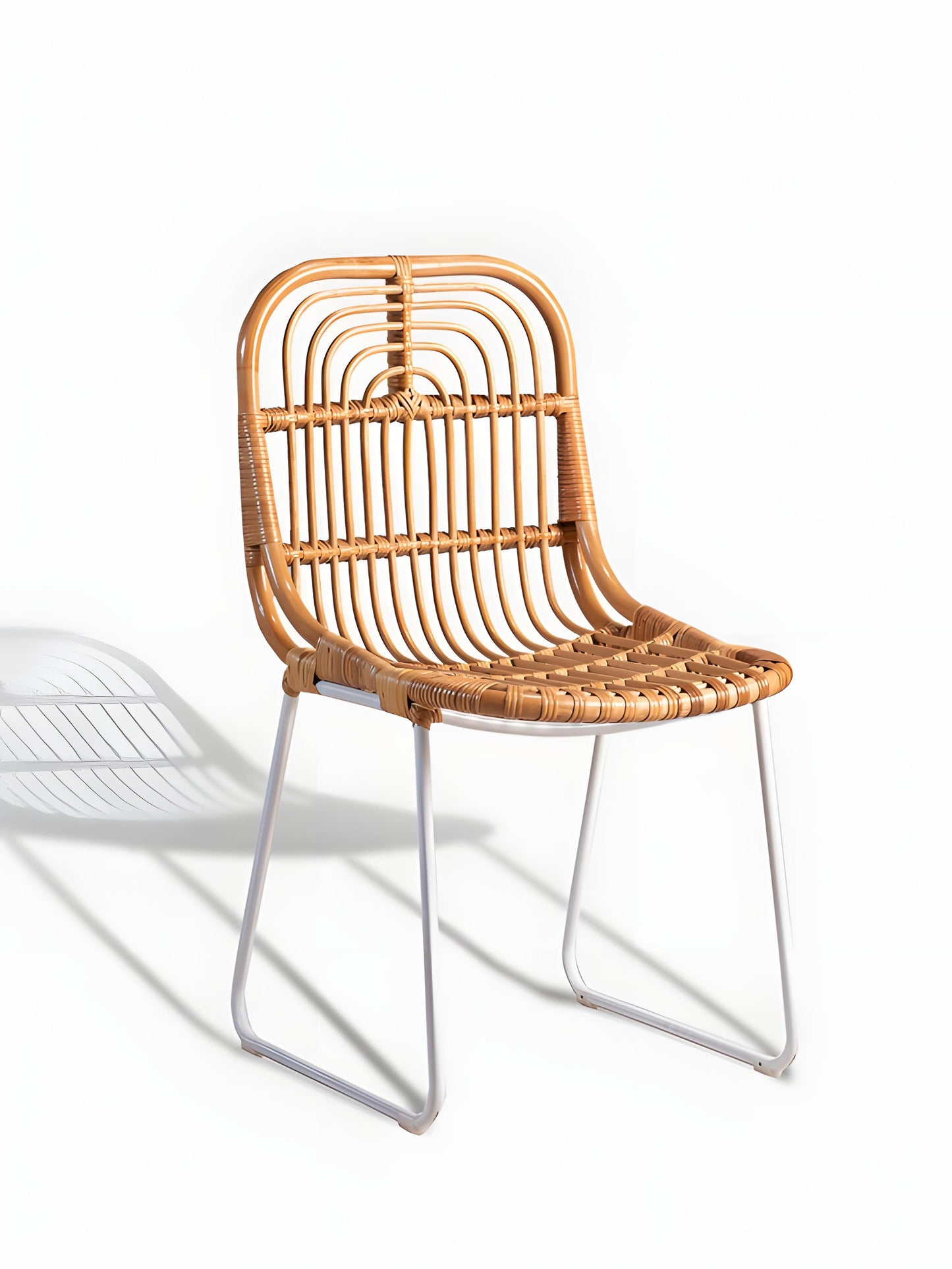 Aitor Rattan Dining Chairs with white metal legs - front view - Mellowdays Furniture