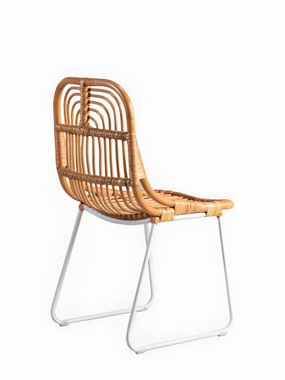 Aitor Rattan Dining Chairs with white metal legs - side view - Mellowdays Furniture