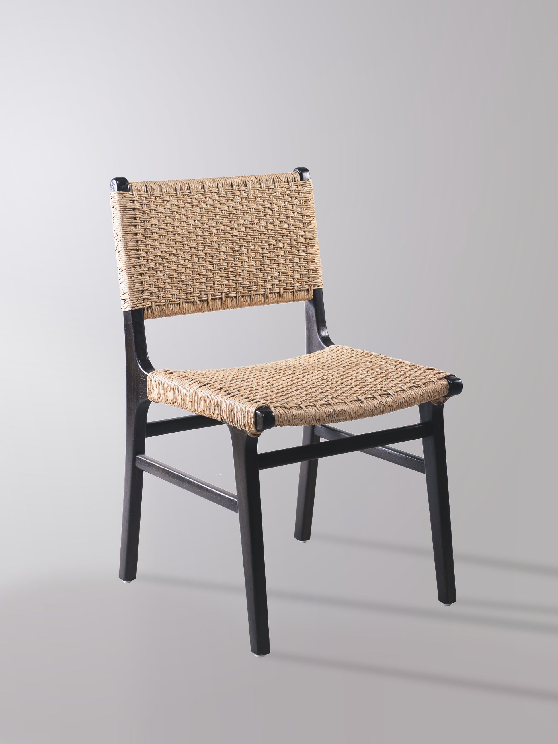 Asturia woven wooden dining chair with handwoven back and seat in mindi wood with black finish | Mellowdays Furniture