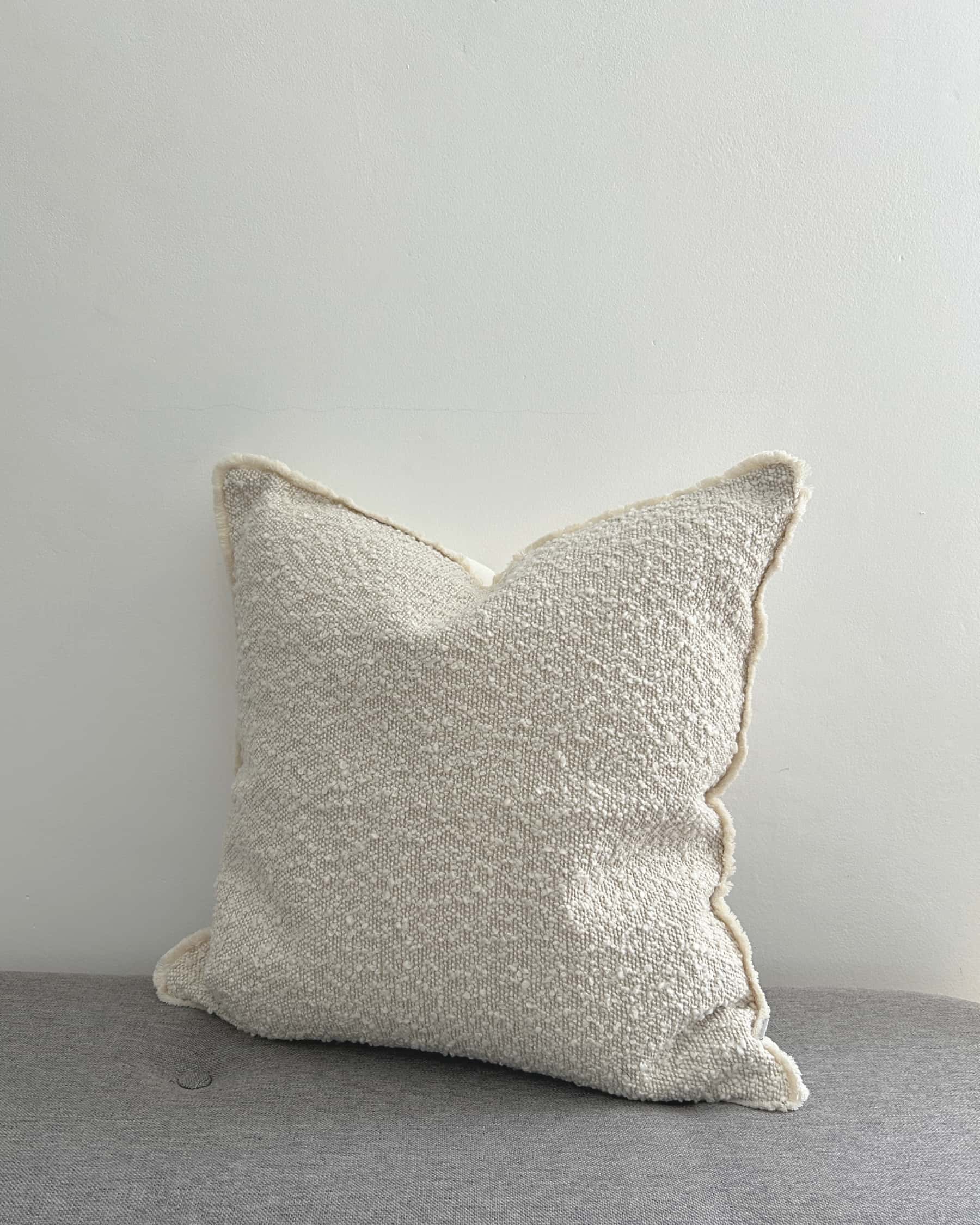 Cream Bouclé Cushion Cover with Fringed Edge 45x45cm side view | Mellowdays Furniture