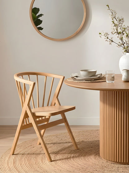 Falconi dining chair at round table