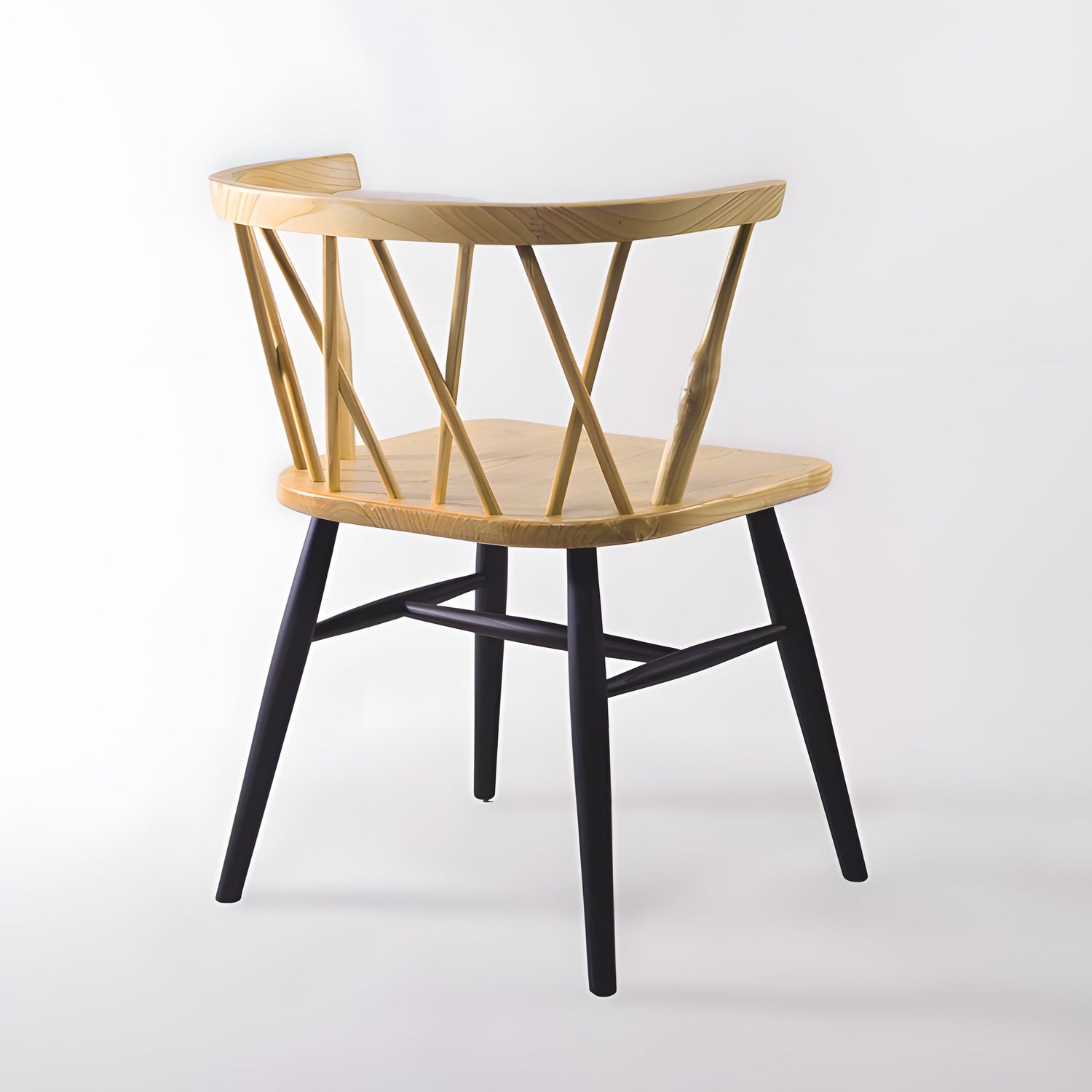 The Fallas Dining Chair effortlessly combines modern sophistication with Nordic-inspired simplicity, ideal for those seeking wooden dining chairs with cross backs that blend style and tradition.