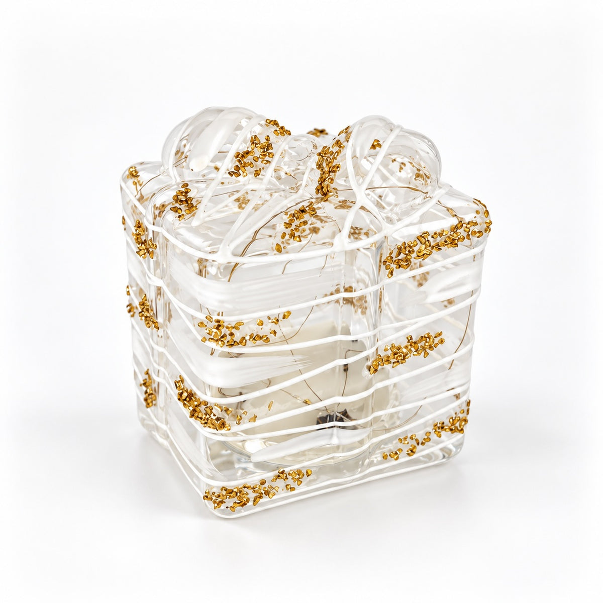 A clear glass gift box with a matching glass ribbon bow, decorated with scattered small gold glitter accents