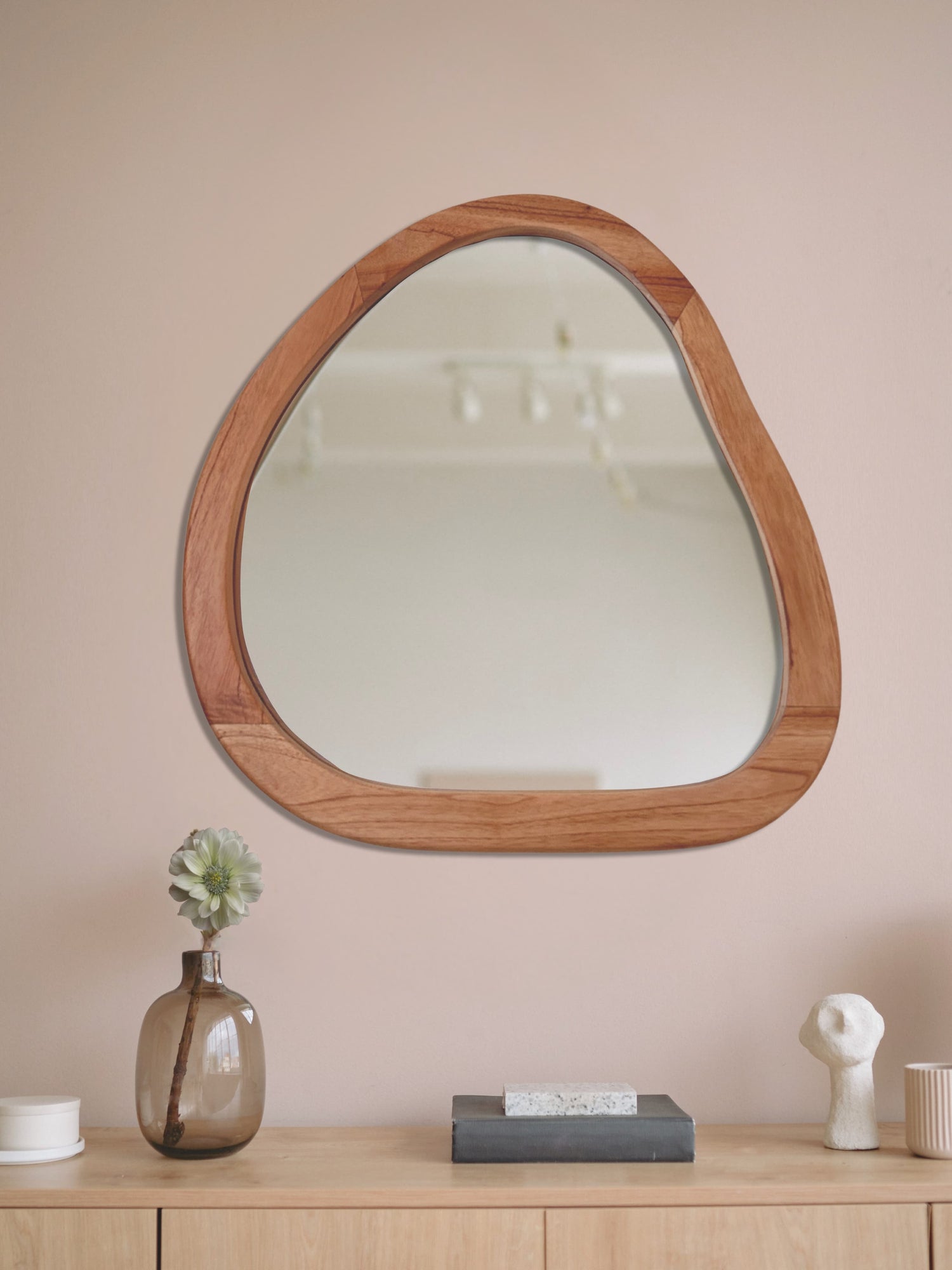 Organic shaped wooden wall mirror with natural wood frame hanging above modern sideboard | Mellowdays Furniture
